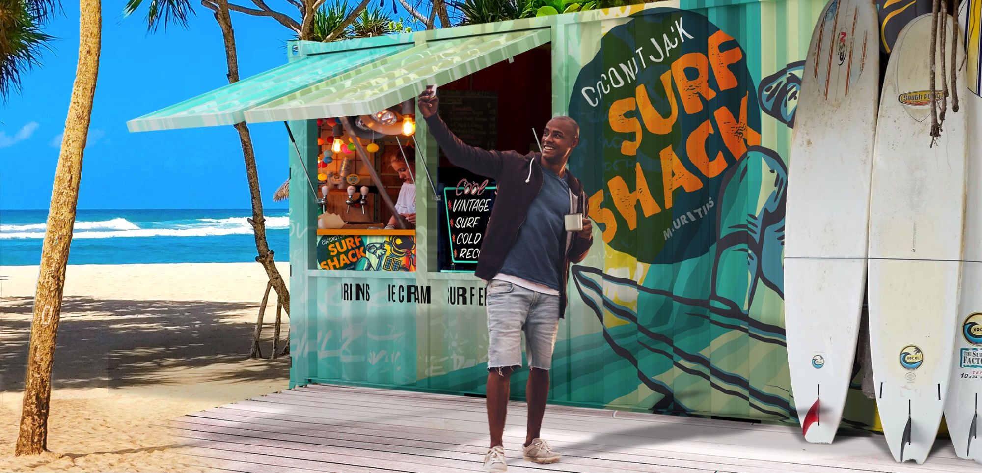 Shipping container store with two open window flaps and two talking women inside. The container is sitting on a beach with the ocean in the background and palm trees behind the container.