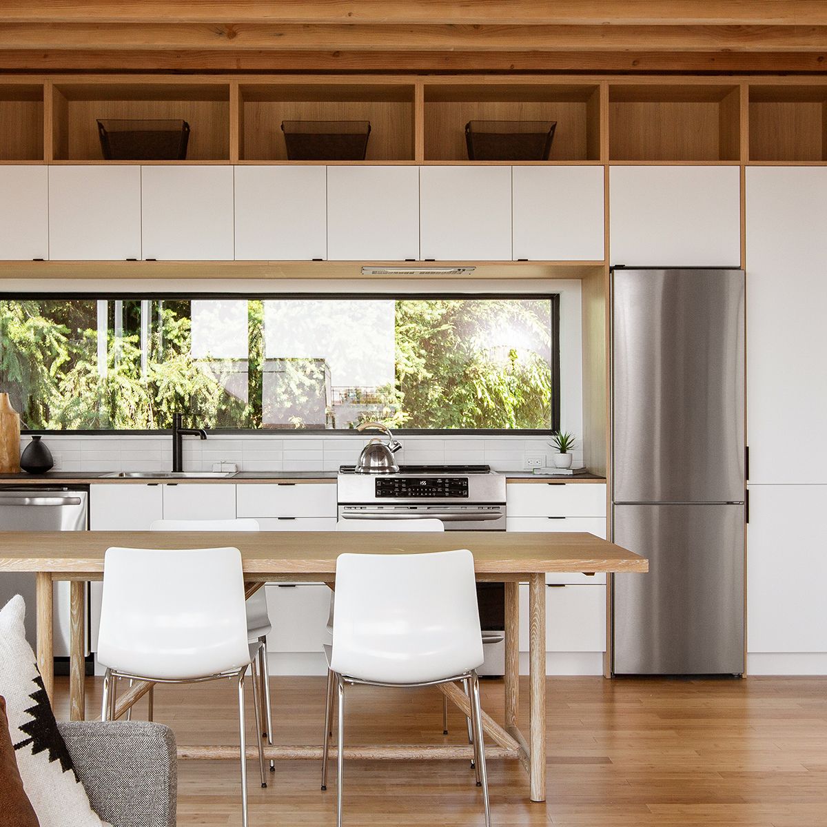 Modern kitchen, light wood counter tops with white cabinets