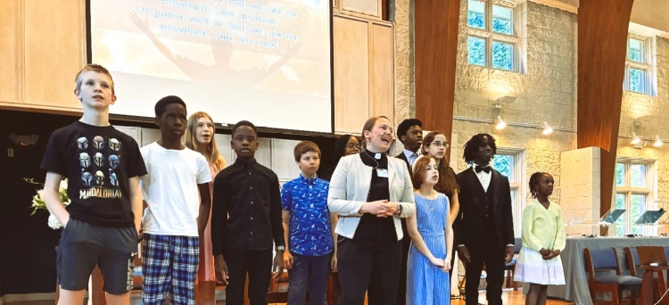 Minister and Youth singing on church chancel