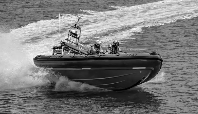 Patrol boat moving at high speed.