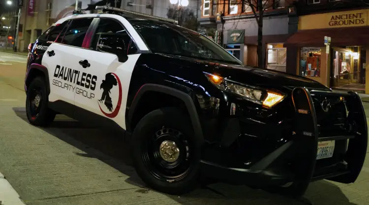 Patrol Vehicle parked on a busy street in the city.