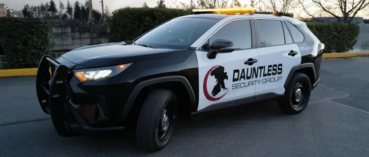 Dauntless patrol vehicle in parking lot displaying the logo on the side.