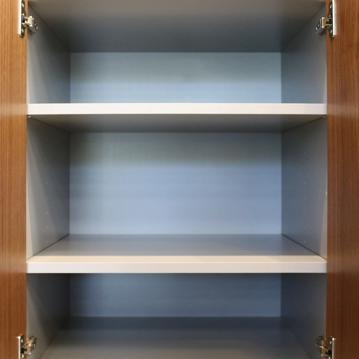 Inside of cabinet, white shelves